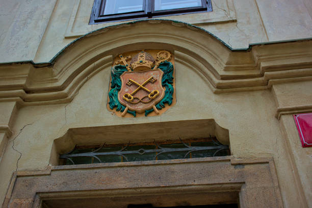 istock A Vysehrad Chapter as small blazon on wall stone in Prague. Czech republic. 2118945594