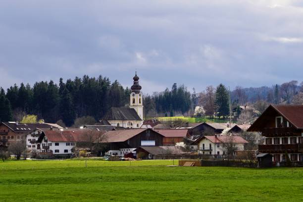 istock A German village under a dramatic sky. Early spring in a Bavarian village. A village in Upper Bavaria. Spring is in the village. The approach of bad weather. 2118976000