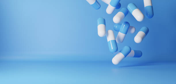 istock 3D Illustration.Lots of blue and white capsules on blue background. Pill.Copy space. (horizontal) 2118979043