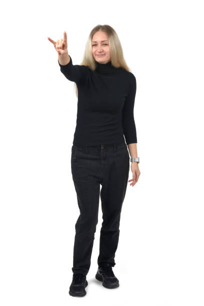 front view of a woman showing the horns sign with fingers looking at camera on white background