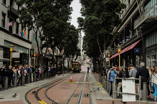 San Francisco, CA, USA - August 14, 2017: A queue of tourists waiting to board the Powell-Hyde historic cable car in Powell Street, San Francisco.