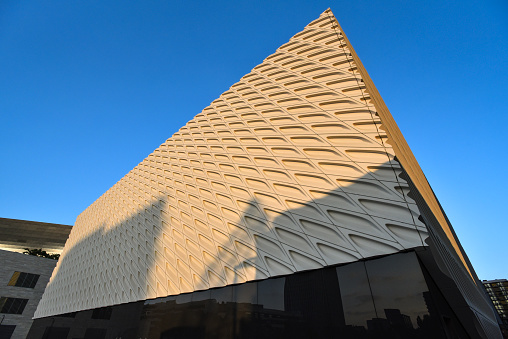 Los Angeles, California, USA - April 3, 2020: Daytime panoramic view of the Disney concert hall located along Grand Avenue. Designed by Frank Gehry (opened 2003), this is one of the four venues of the LA Music Center on Grand Avenue which  is home to other cultural institutions such as the Broad museum as well as residential and office towers.