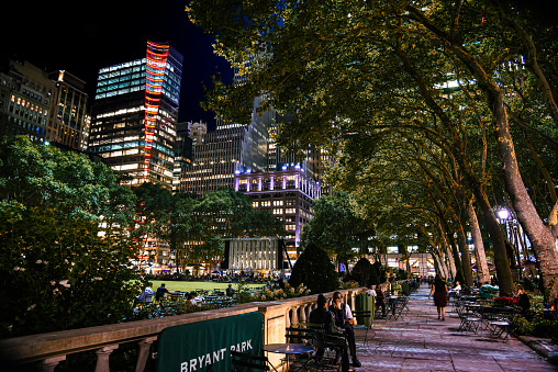 New York, NY, USA - August 8, 2017: Leisure time in Bryant Park at night.