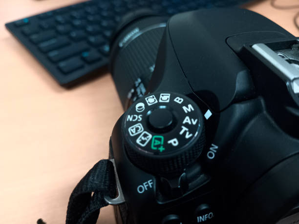 istock Black DSLR camera photo complete with lens 2119024578
