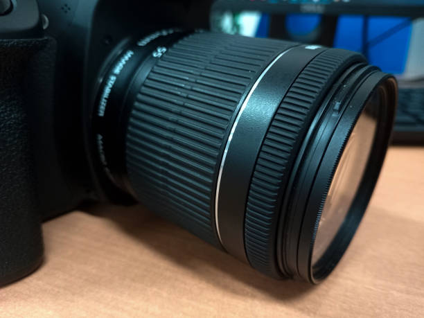 istock Black DSLR camera photo complete with lens 2119025067