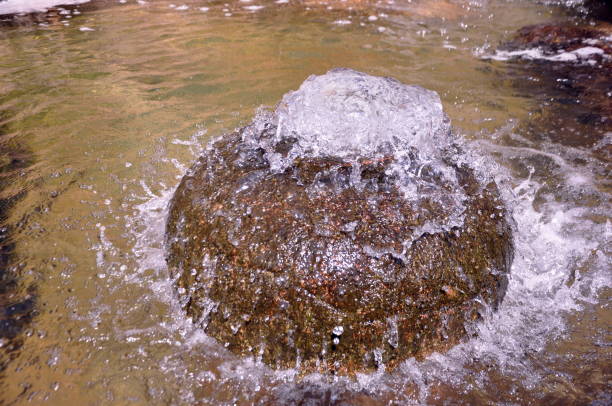 Water gushes from a decorative circular fountain in the pond. Eskisehir, Turkey. 09/17/2017