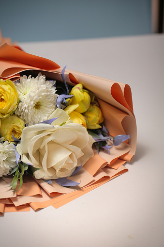 A stunning bouquet of flowers placed on a table, with ample copy space.