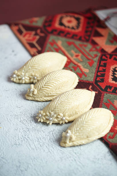 Group of Four White Flowers on Rug