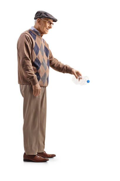 istock Full length profile shot of a senior man throwing a plastic bottle 2119062034