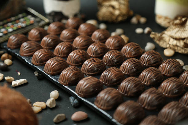 istock Abundant Assortment of Chocolates and Nuts on a Table 2119068410