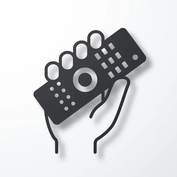 Vector illustration of Hand holding up remote control. Icon with shadow on white background
