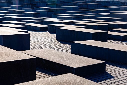 Berlin, Germany - March 19, 2024: Memorial to the Murdered Jews of Europe. A Holocaust memorial with 2,710 concrete columns forming the Field of Stelae.