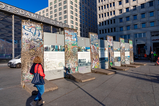 Berlin, Germany - March 19, 2024: objects of the old Berlin wall at the Potsdamer platz to remember the cruelties of separation.