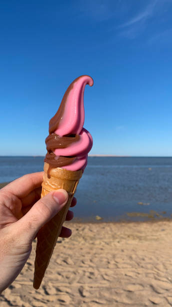 istock Ice cream melting against backdrop of sea 2119099095