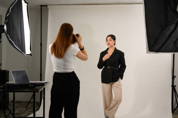 istock Beautiful young mode for professional photographer in photo studio 2119107512