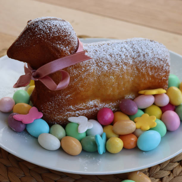 istock Traditional  Easter lamb cake  on a plate with chocolate eggs on table 2119112282