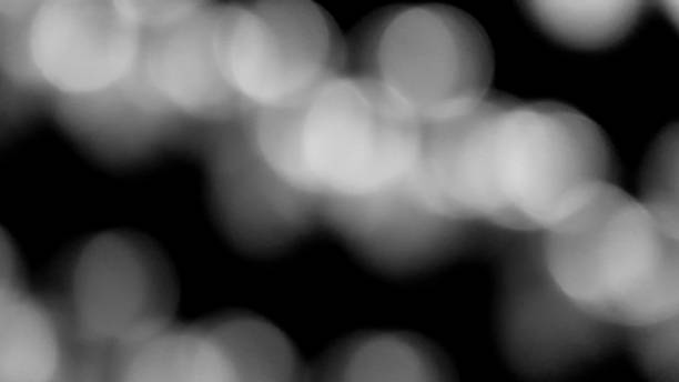 istock Blurred white Bokeh of light on black background. 2119114449