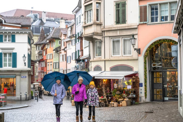 istock Family explores old town on a rainy day 2119115509