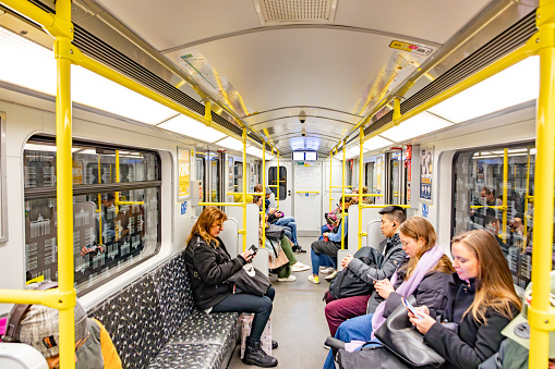 Berlin, Germany - March 19, 2024: people riding in the subway at the underground  in Berlin, Germany.