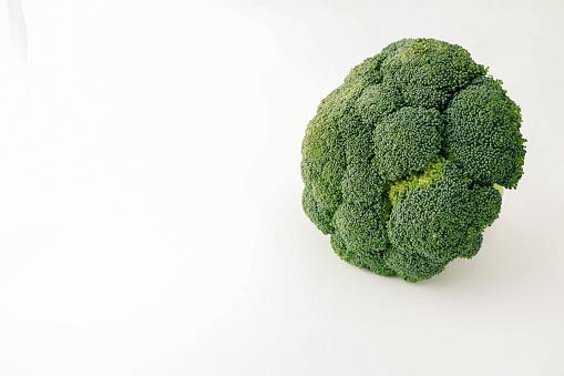 Juicy broccoli isolated on white background.