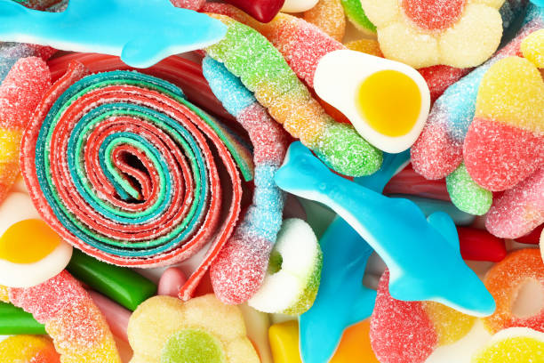 istock Gummy candies all over background, close up 2119206942