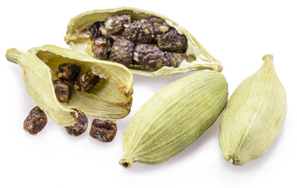 istock Green cardamom pods and seeds isolated on white background. 2119229868