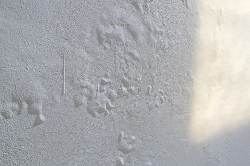 Saltpeter on the wall, Closeup of wall stained with water infiltration. Potassium nitrate, which is present in the building materials comes into contact with oxygen and creates excess moisture on the wall.