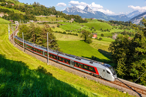 Passenger train type Stadler Flirt of Südostbahn at Grosser Mythen mountain in the Swiss Alps in Arth, Switzerland