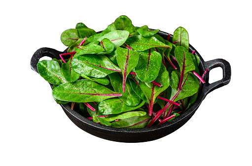 Fresh raw chard leaves,  mangold, swiss chard in a pan.  Isolated on white background. Top view