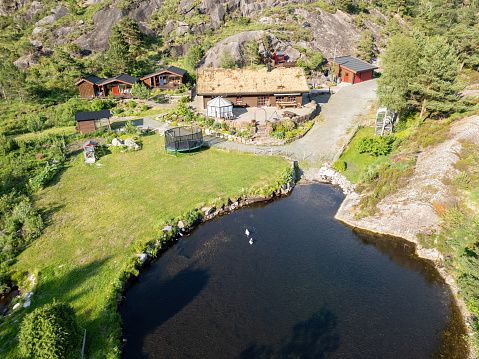 typical holiday resort with a lake in the mountains of Norway