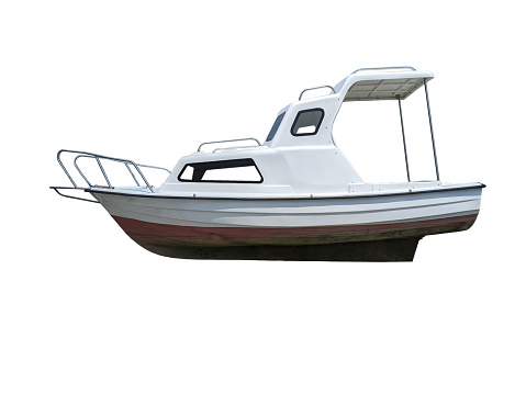 White small motor boat with plastic cabin sunshade and metal rails full frame side view isolated on white