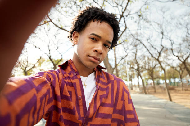 istock Skeptical Black teenager looking at camera 2119412733
