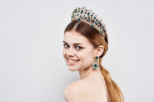 portrait of a woman with a crown on her head makeup model close-up lifestyle. High quality photo