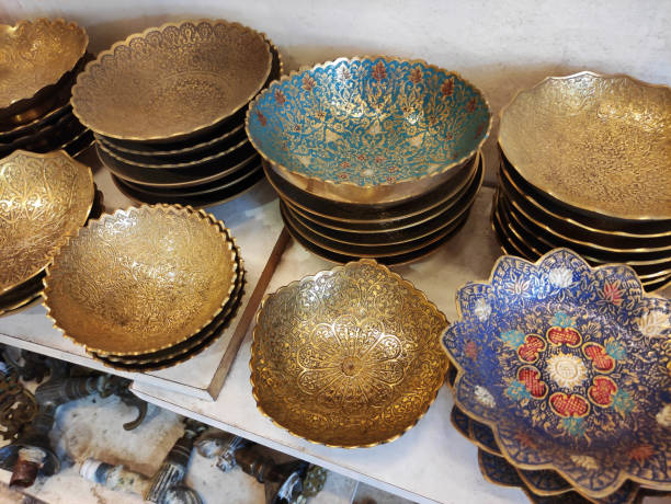 Traditional Oriental Arabic metal plates with decorative pattern on the shop a window