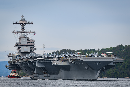 USS Gerald R. Ford aircraft carrier on it's departure from visiting Oslo port in 2023