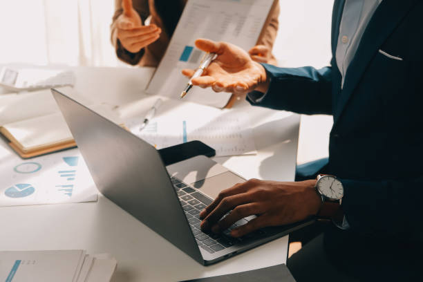 istock Business team working with new startup project plan and discussion information for financial strategy with laptop and digital tablet in a modern business lounge. 2119541613