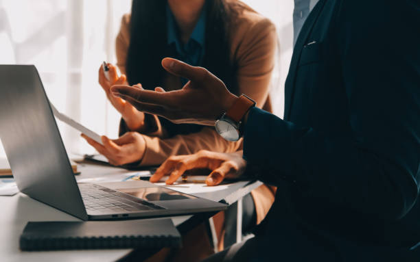 istock Business team working with new startup project plan and discussion information for financial strategy with laptop and digital tablet in a modern business lounge. 2119541618