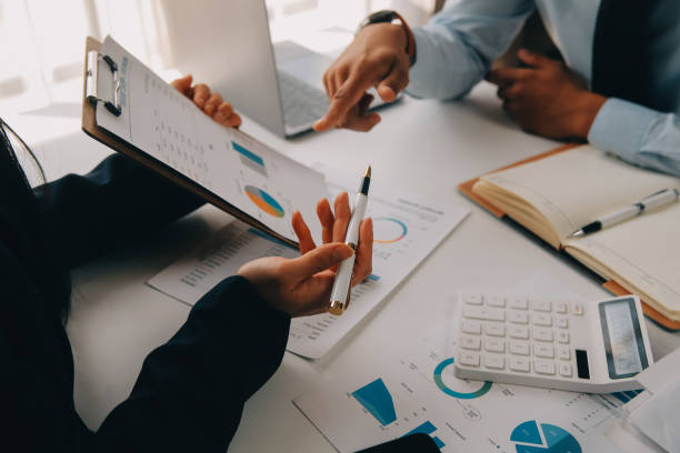 istock Business team working with new startup project plan and discussion information for financial strategy with laptop and digital tablet in a modern business lounge. 2119542127