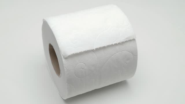 Panorama of toilet paper roll on white background.