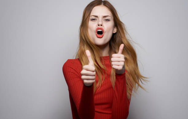 istock Pretty woman gestures with her hands Model Copy Space emotions 2119567799
