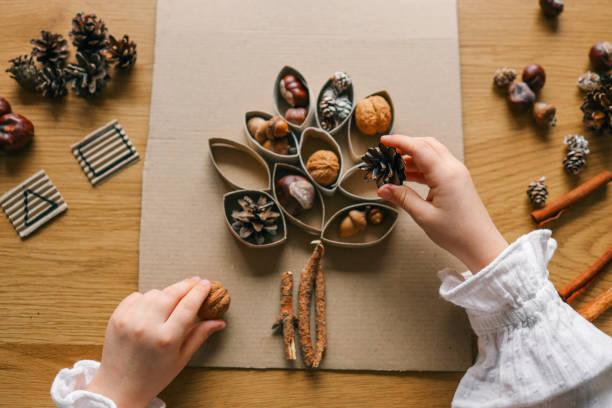 istock Montessori and Sensory Development, A child plays with natural materials 2119572456
