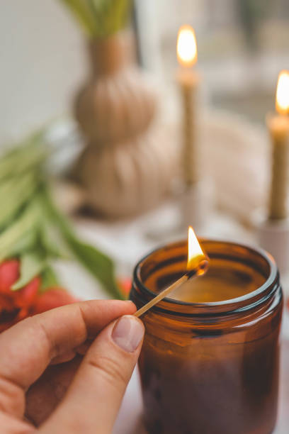 istock Girl lights a candle, spring aesthetics 2119572980