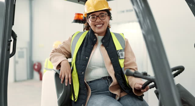 Woman face, engineering and foreman on forklift for building and construction project. Happy, warehouse employee and smile for renovation, industrial and factory transport on site for architecture