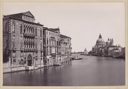 Historical view of Venice, Italy: View from the Ponte dell'Accademia bridge onto the Grand Canal. Left side the Palazzo Cavalli-Franchetti and in the background the church of Santa Maria della Salute. Original photograph (scanned and slightly restored) from the book 