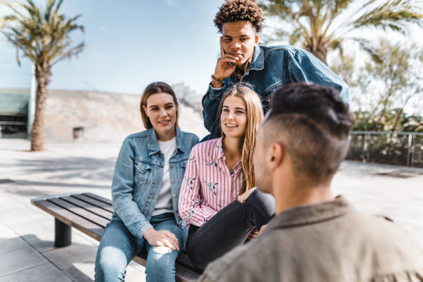 istock friends all together in the bench 2119632117