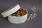 Peanuts in box. Gift to Women's Day (8 March), Women's Day. Mother's Day Valentines day. Festive round box.
