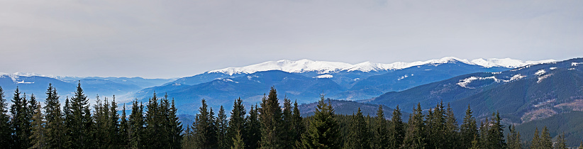 panoramic view of snow-capped peaks from the slope at a ski resort