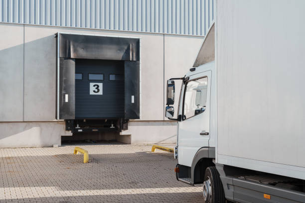 istock truck at loading dock of a warehouse 2119683975