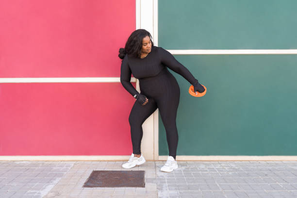 istock Overweight woman working out 2119716834