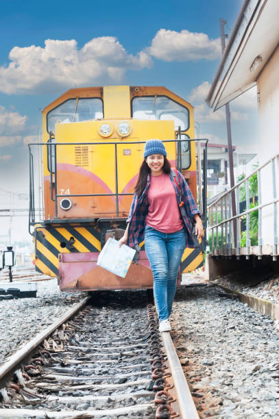 istock Young Asian tourist traveling on train 2119730232